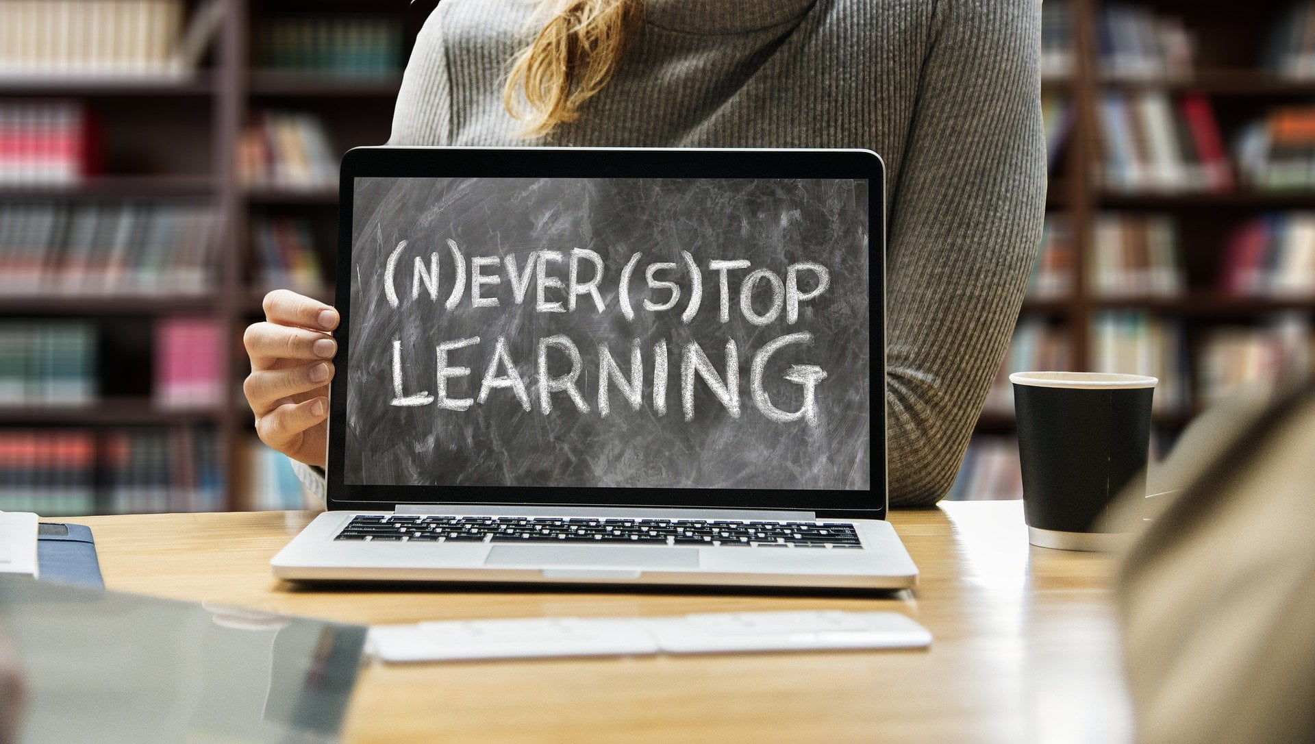 A laptop with the inscription, 'never stop learning'.